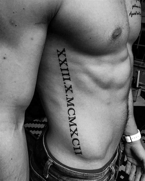 roman numerals rib tattoo|More.